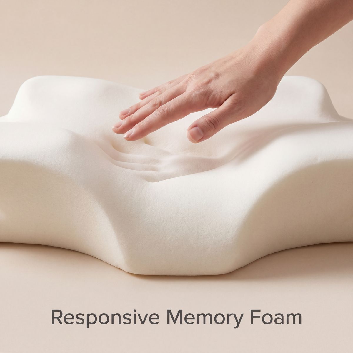 Hand touching a Responsive Memory Foam pillow on a beige background