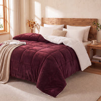 Bedroom with a bed featuring a teddy sherpa ultra warm burgundy doona and and white pillows.
