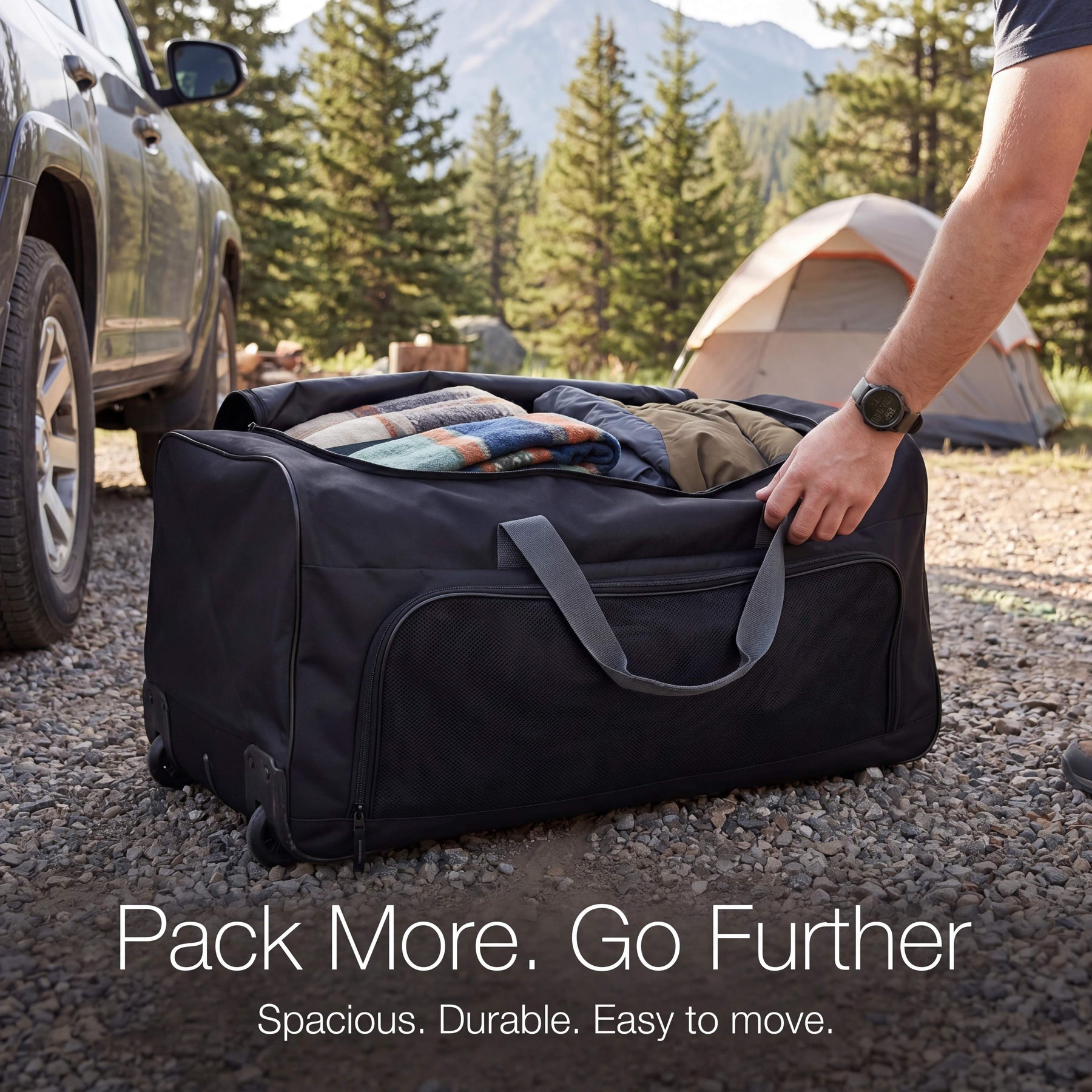 Person packing a black duffel bag with camping gear near a vehicle and tent in a forest setting.