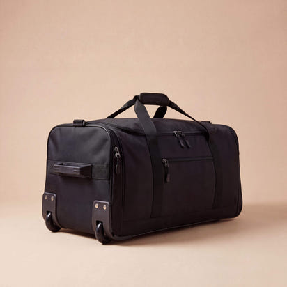 Black travel duffel bag on a beige background