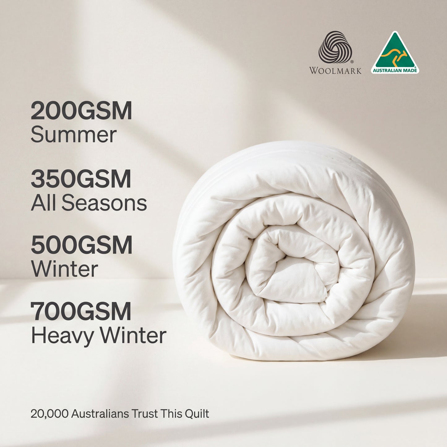 Roll of quilt with GSM weight information and Woolmark logo on a light background