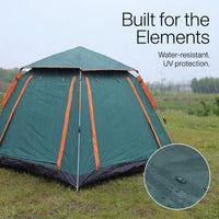 Green camping tent with orange accents in a grassy field, featuring water-resistant text.