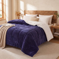 Bedroom with a bed featuring a purple teddy sherpa doona pillows and wooden headboard.