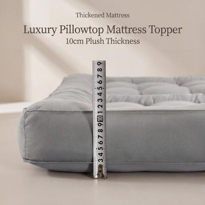 Gray luxury pillowtop mattress topper with a ruler for scale on a neutral background